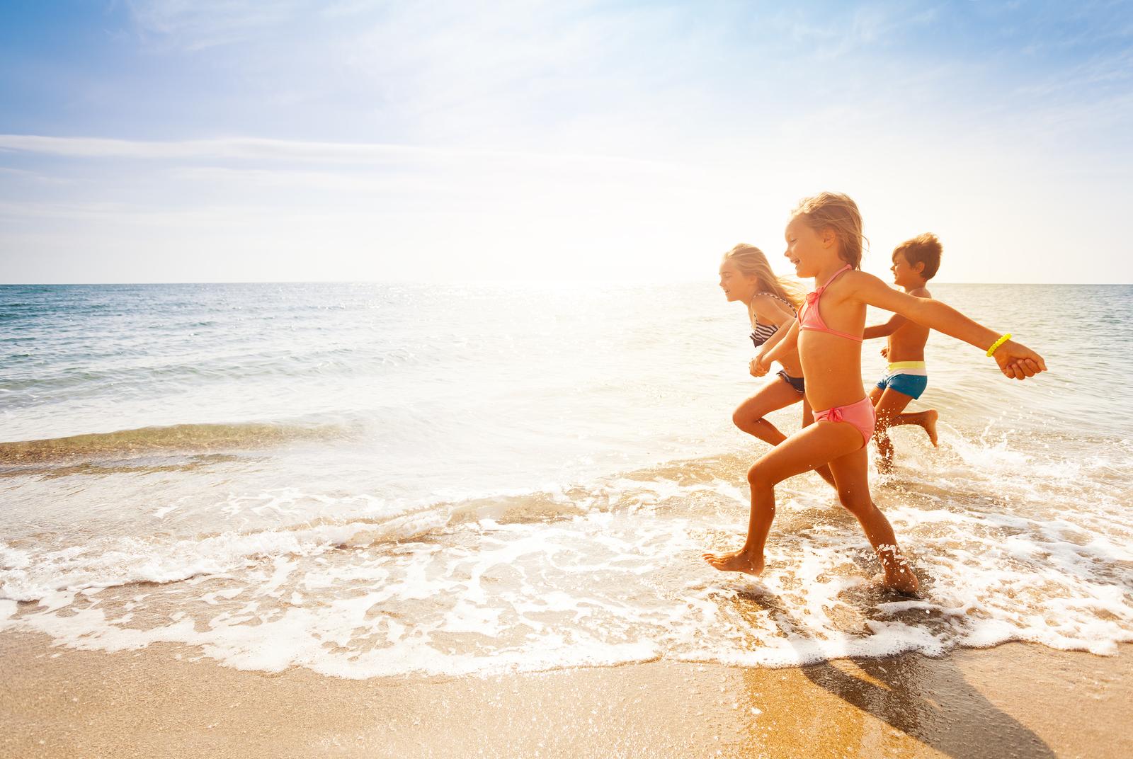 Kids running on beach