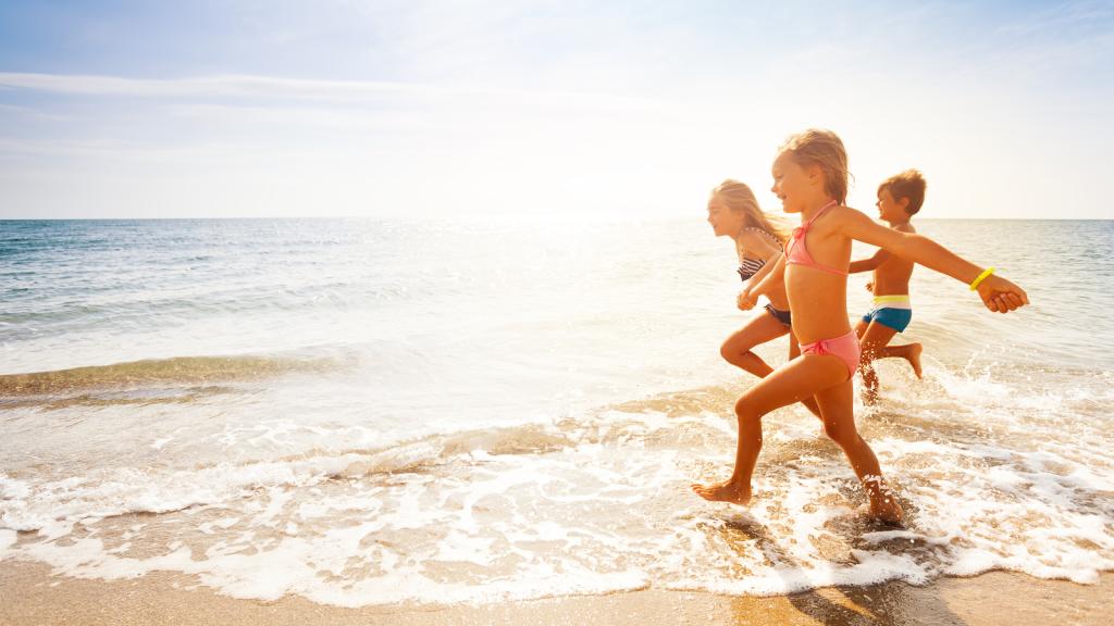 Kids running on beach