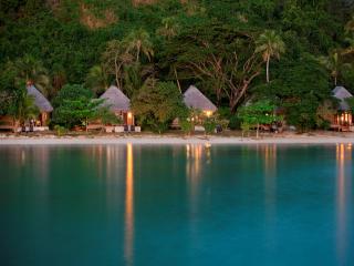 Deluxe Beachfront Bures at dusk