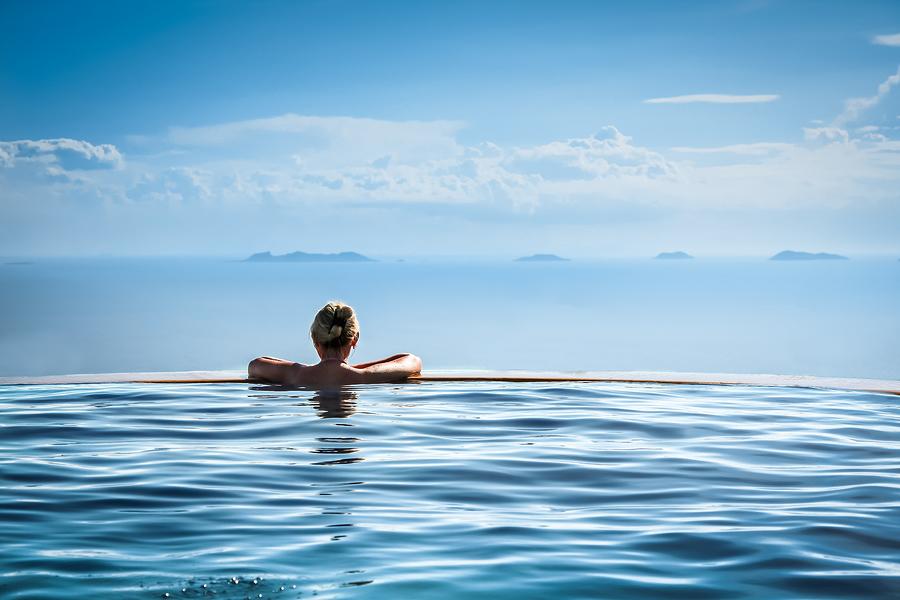 Generic - Luxury - Woman Relaxing in Infinity Pool