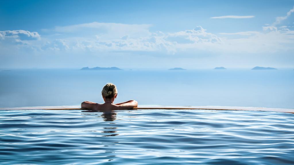 Generic - Luxury - Woman Relaxing in Infinity Pool