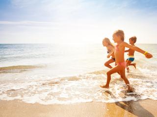 Kids running on beach