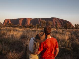 Couple at Uluru at Sunrise - Tourism Australia - Nicholas Kavo