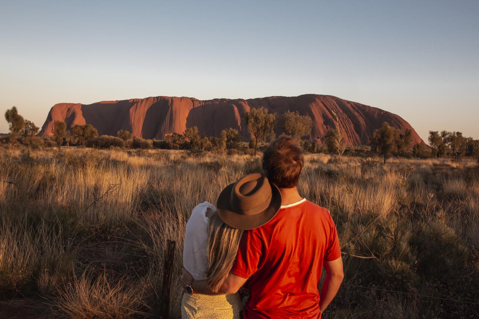 Couple at Uluru at Sunrise - Tourism Australia - Nicholas Kavo
